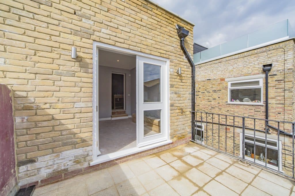 Fulham Outdoor terrace with brick walls, tiled flooring, and access to the interior living space