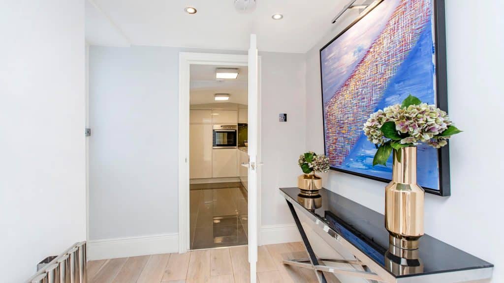 Contemporary hallway with marble flooring and access to luxury rooms