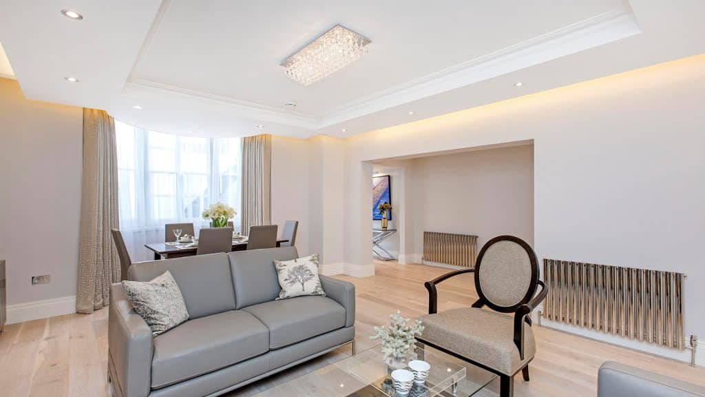 Gloucester Terrace Contemporary living and dining area with soft lighting and elegant furniture